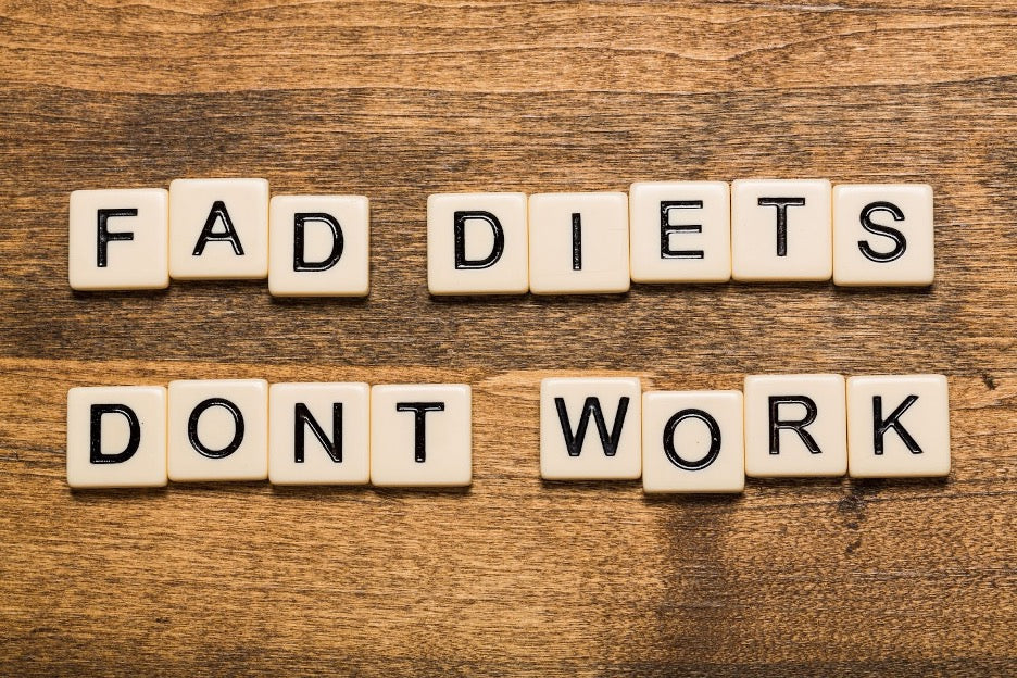 Scrabble letters spelling: Fad diets don’t work.
