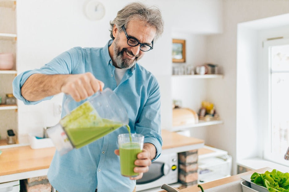 A man pouring an immune-boosting smoothie.