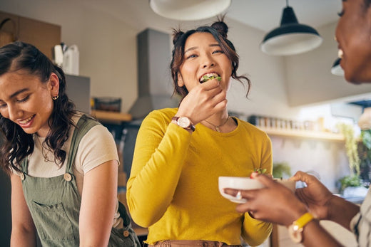 A person eating whole foods at a party.